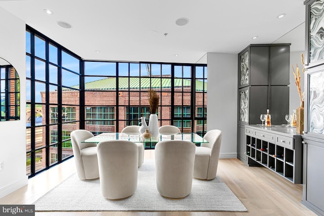 dining space with light hardwood / wood-style floors