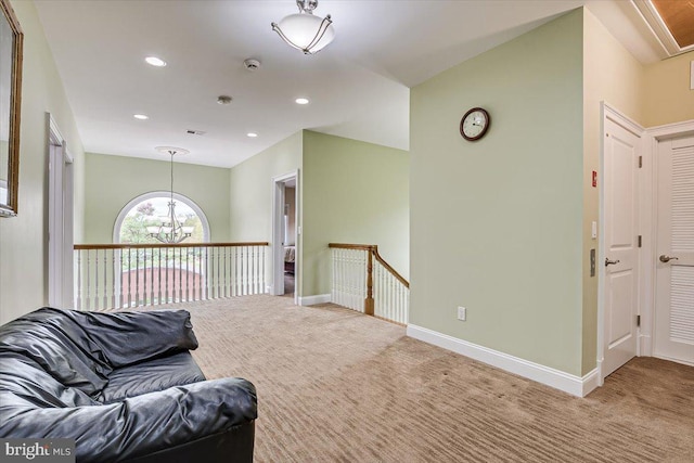 interior space featuring a notable chandelier and carpet flooring