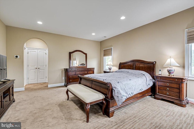 carpeted bedroom with a closet