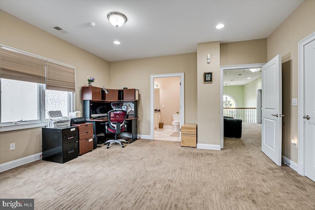 home office with light carpet and a wealth of natural light