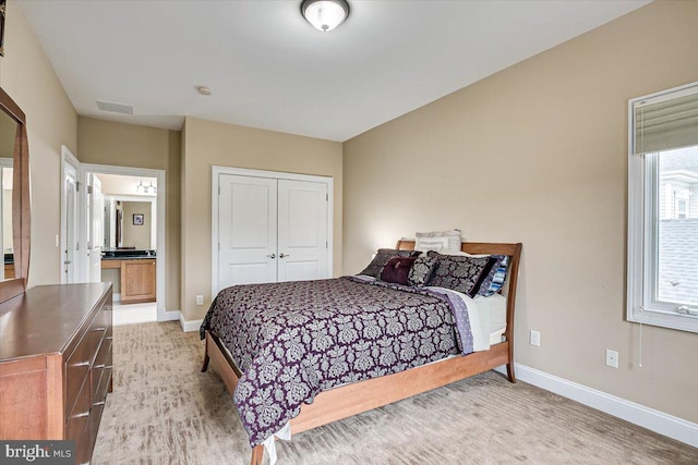 carpeted bedroom with a closet