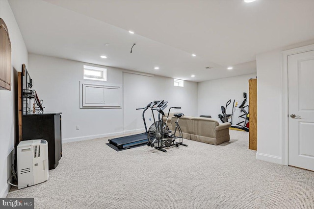 workout room featuring light colored carpet