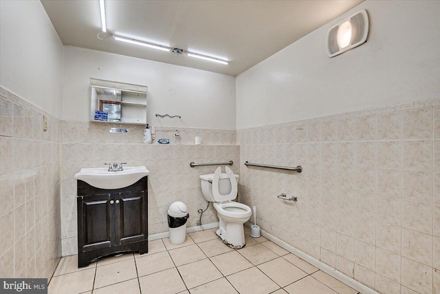 bathroom featuring tile walls, tile patterned flooring, vanity, and toilet