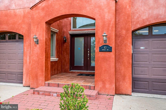 doorway to property featuring a garage