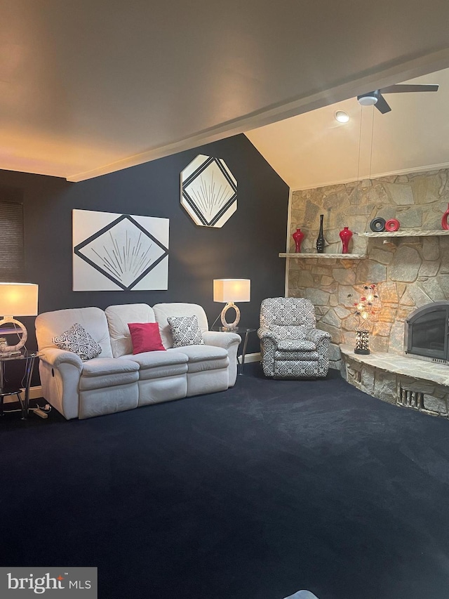 living room with crown molding, carpet, vaulted ceiling, and a fireplace