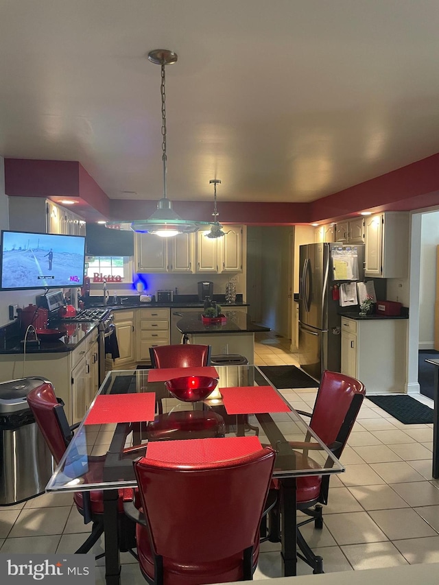 tiled dining space featuring sink