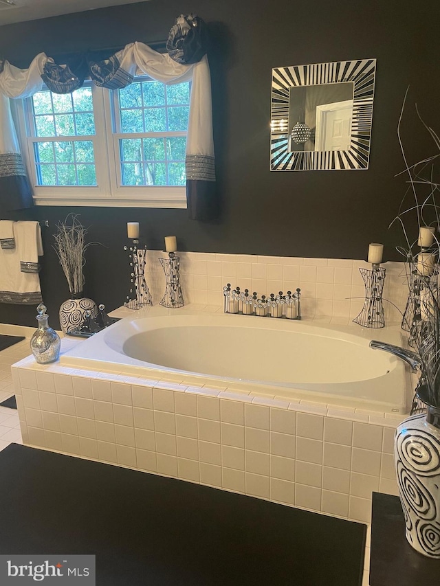 bathroom with tiled bath