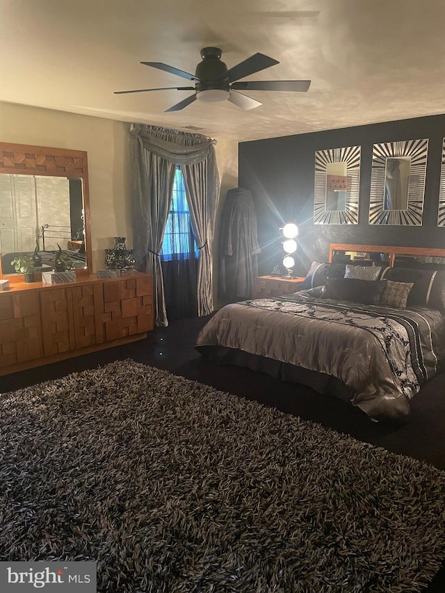 carpeted bedroom with ceiling fan