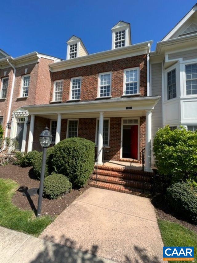 view of property featuring covered porch