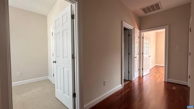 hallway with dark wood-type flooring