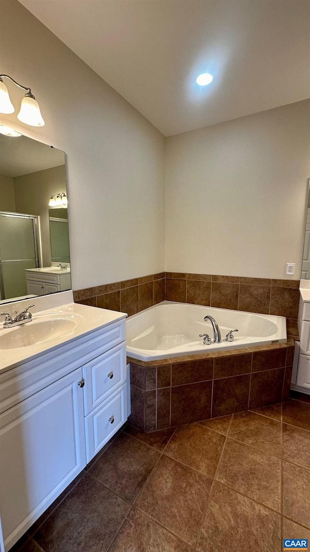 bathroom with vanity, tile patterned flooring, and separate shower and tub