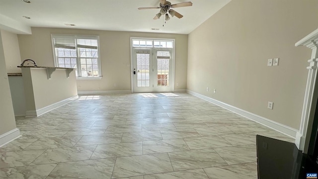 unfurnished room featuring ceiling fan and vaulted ceiling