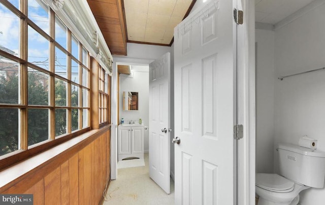 bathroom featuring ornamental molding, wooden ceiling, vanity, and toilet