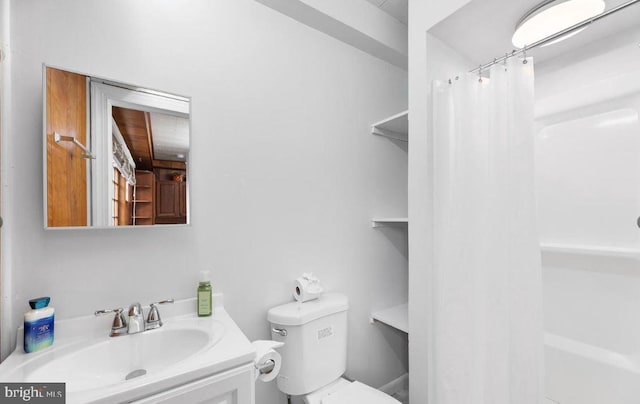 bathroom featuring vanity, toilet, and a shower with shower curtain