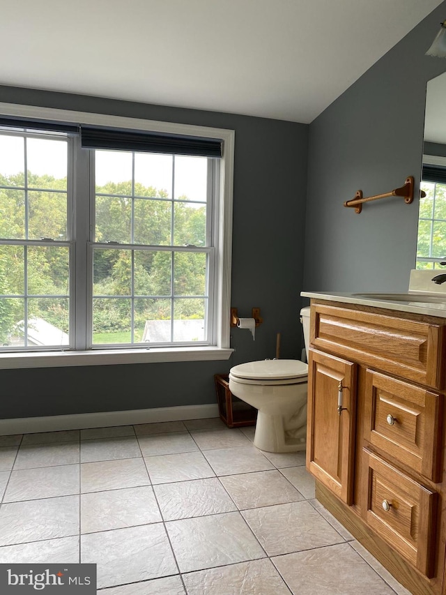 bathroom featuring vanity, toilet, and tile patterned floors