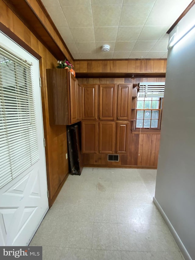 interior space featuring wooden walls