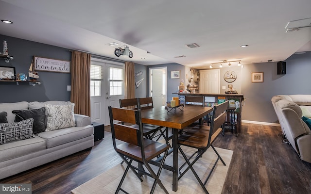 dining area with wood-type flooring