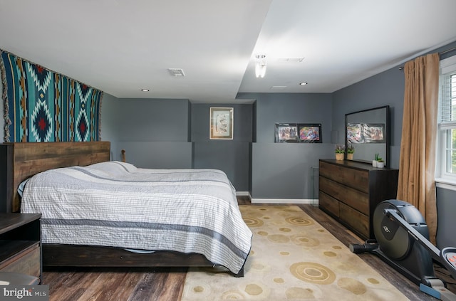 bedroom with wood-type flooring