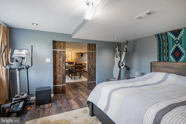 bedroom featuring dark hardwood / wood-style flooring