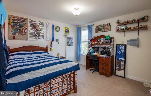 bedroom featuring light carpet