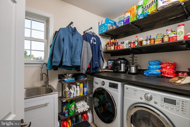 laundry area featuring separate washer and dryer and sink