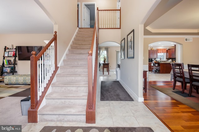 staircase featuring wood-type flooring