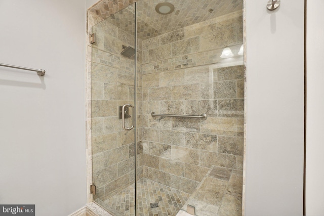 bathroom with a shower with shower door