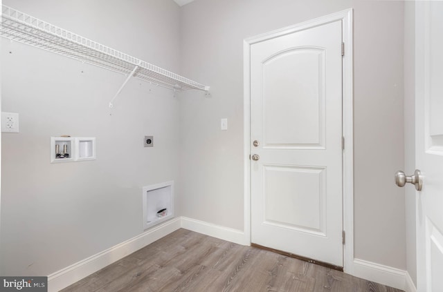 laundry room with hookup for a washing machine, light hardwood / wood-style floors, and electric dryer hookup