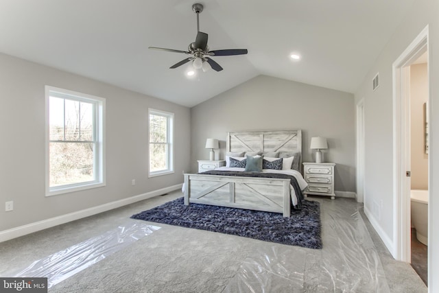 bedroom with carpet floors, lofted ceiling, ceiling fan, and ensuite bathroom