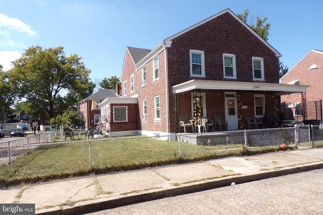 view of property featuring a front yard