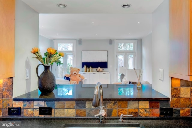 kitchen with backsplash and sink