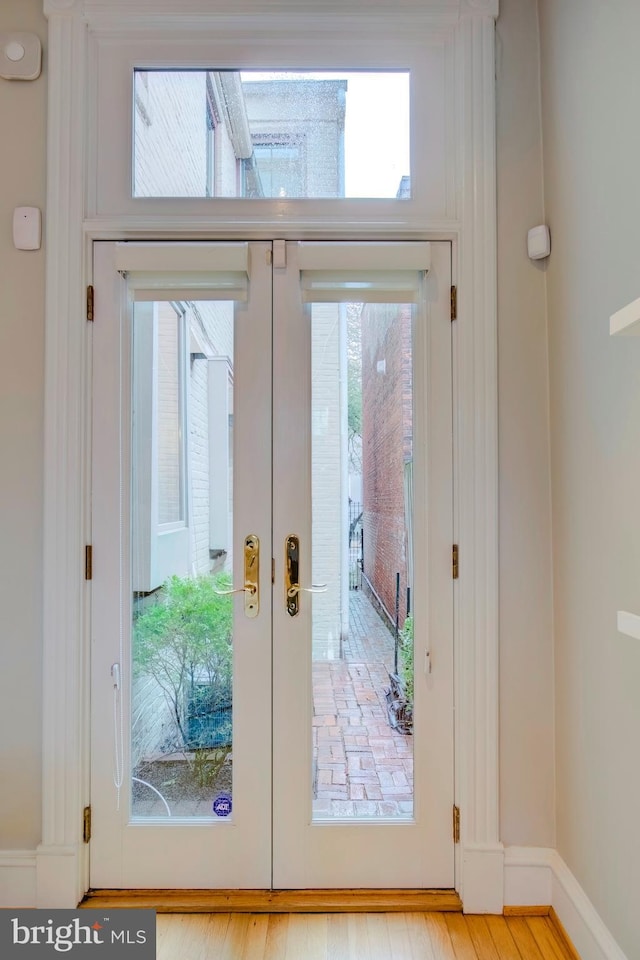 entryway featuring french doors and light hardwood / wood-style flooring