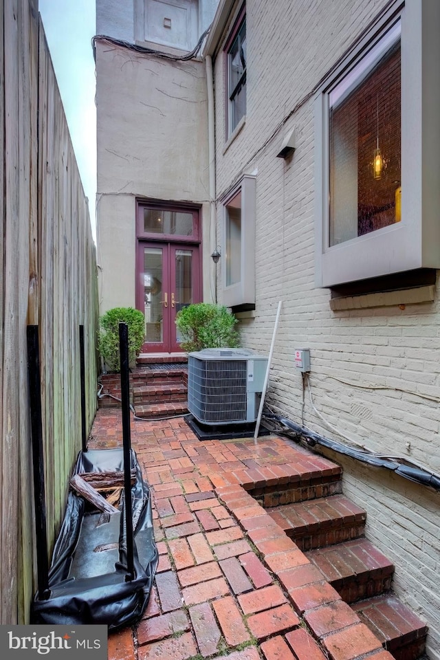 view of patio featuring central AC unit and french doors