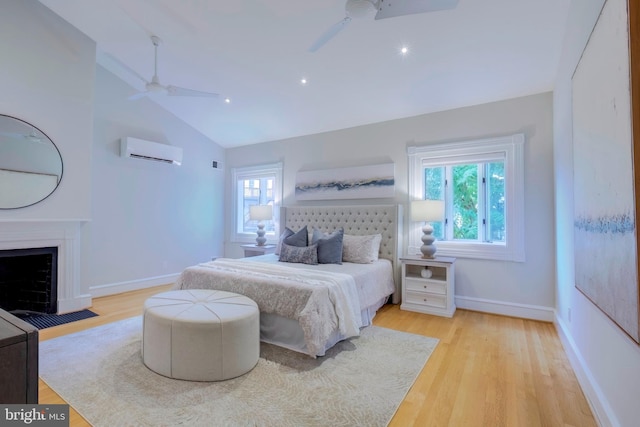 bedroom with multiple windows, lofted ceiling, light hardwood / wood-style floors, and ceiling fan