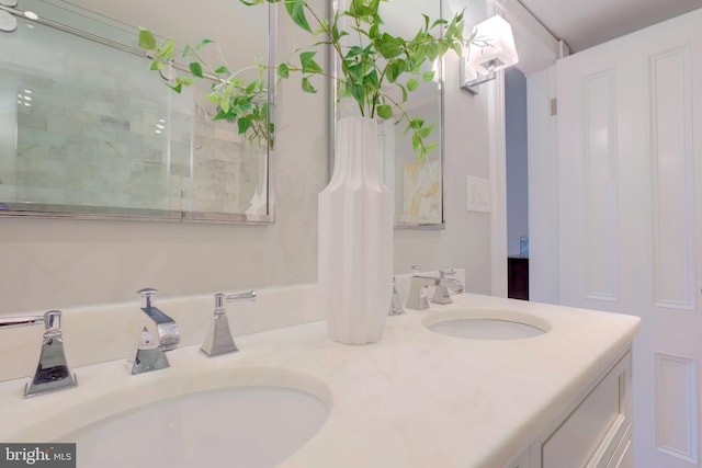 bathroom featuring vanity and a shower with shower door