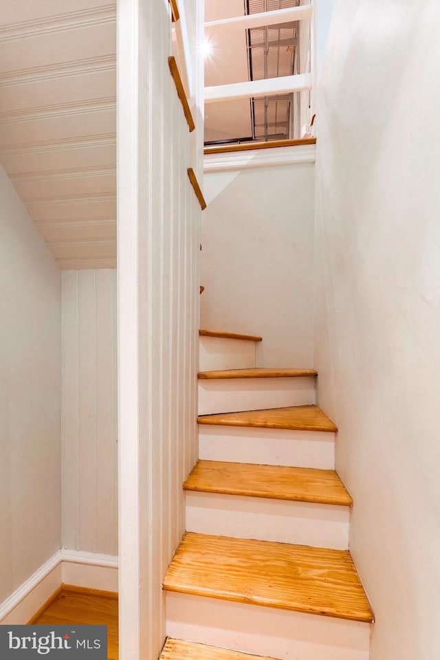 stairway featuring hardwood / wood-style flooring