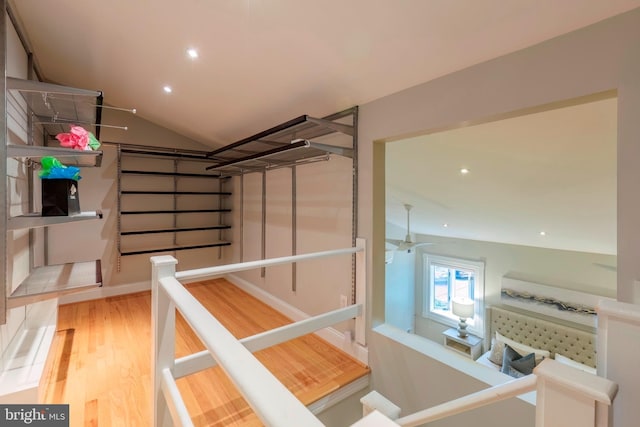 interior space with lofted ceiling and hardwood / wood-style flooring