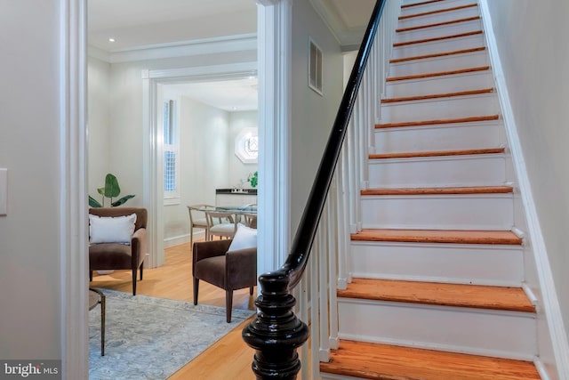 stairs featuring hardwood / wood-style flooring