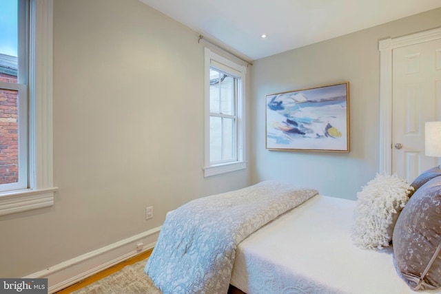 bedroom with hardwood / wood-style floors