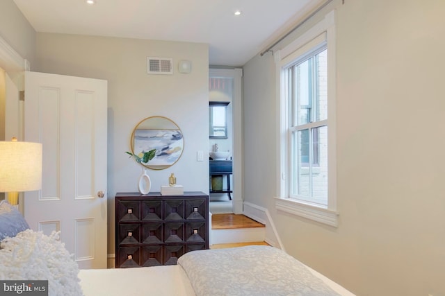 bedroom with wood-type flooring