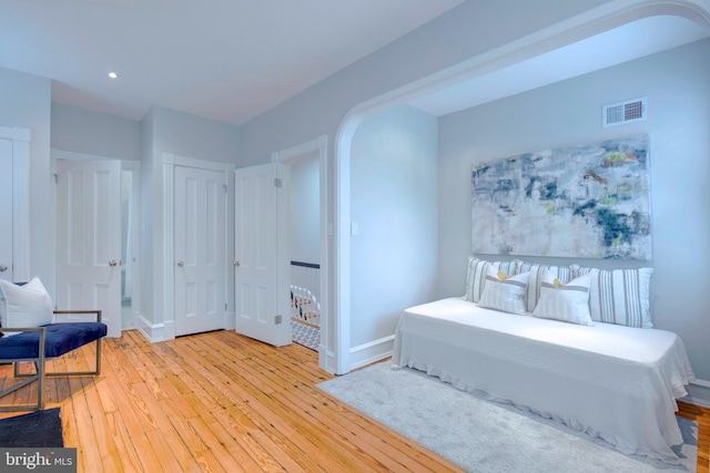 bedroom with light wood-type flooring