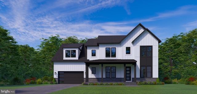 view of front of property featuring a garage, covered porch, and a front lawn