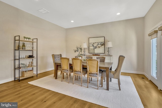 dining space featuring light wood-type flooring