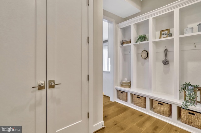 mudroom with light hardwood / wood-style floors