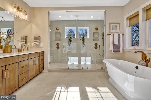 bathroom featuring vanity, radiator, and independent shower and bath