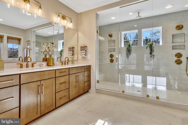 bathroom featuring walk in shower and vanity