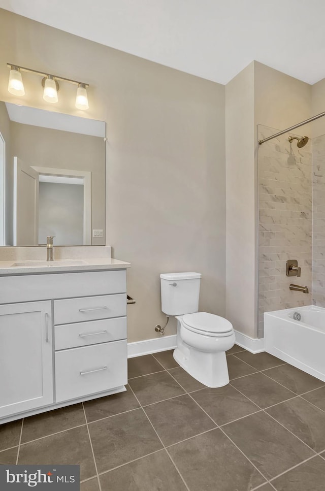 full bathroom featuring tile patterned flooring, vanity, toilet, and tiled shower / bath