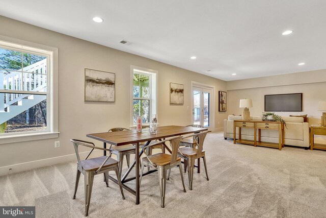 view of carpeted dining area