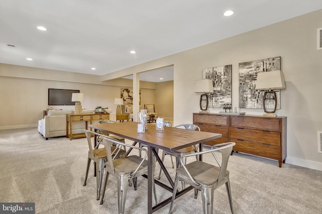 view of carpeted dining space