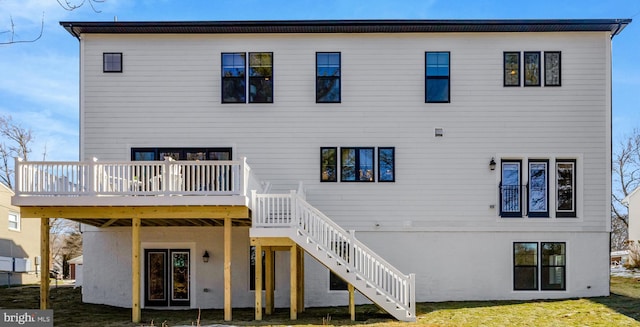 back of house featuring a deck